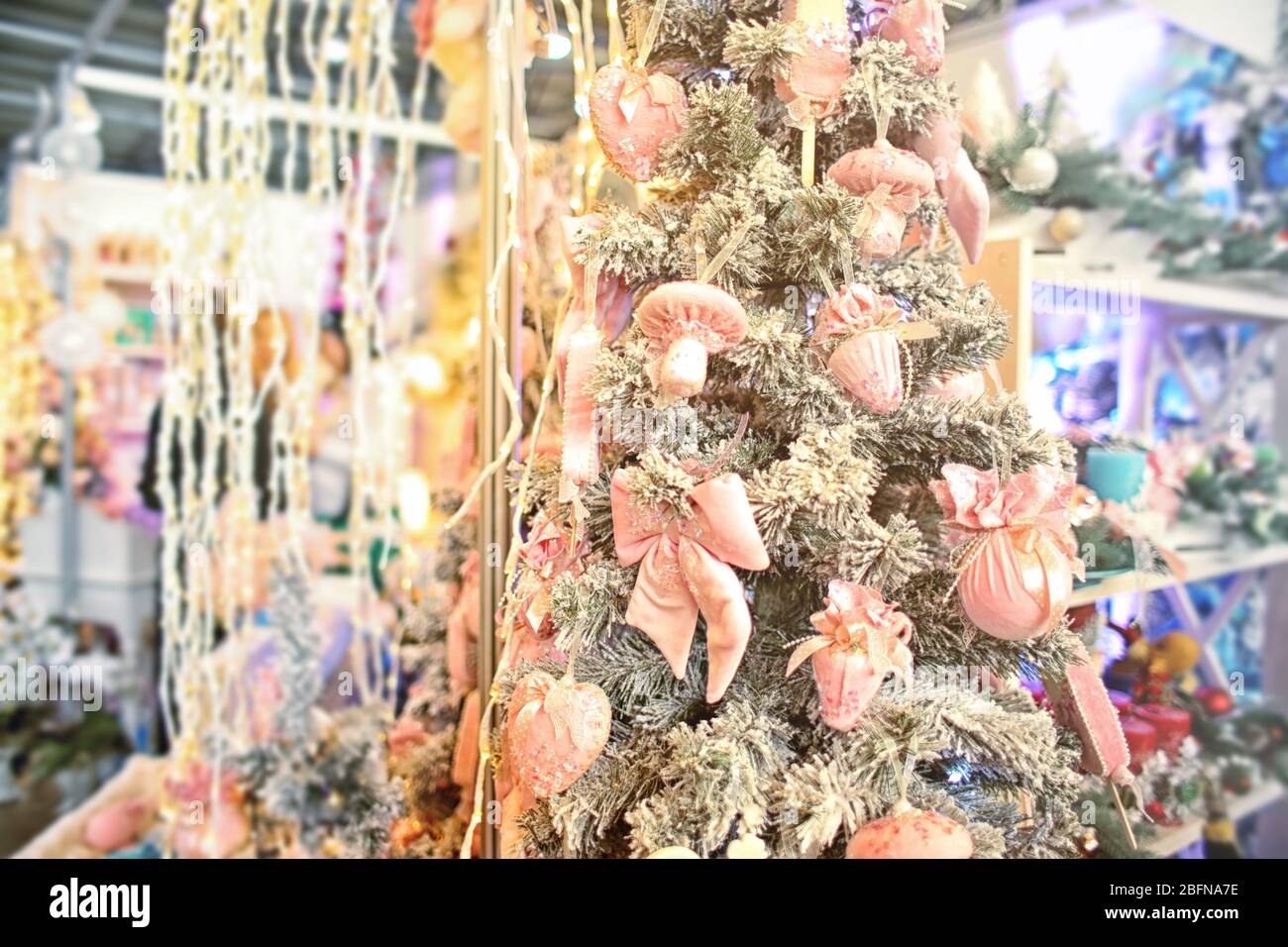 Decorated Christmas tree at warehouse. Christmas retail and wholesale