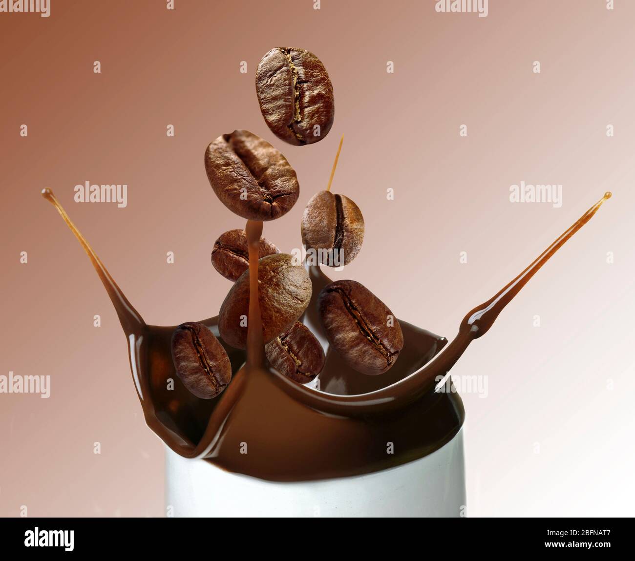 Roasted coffee beans falling into cup, color background Stock Photo - Alamy