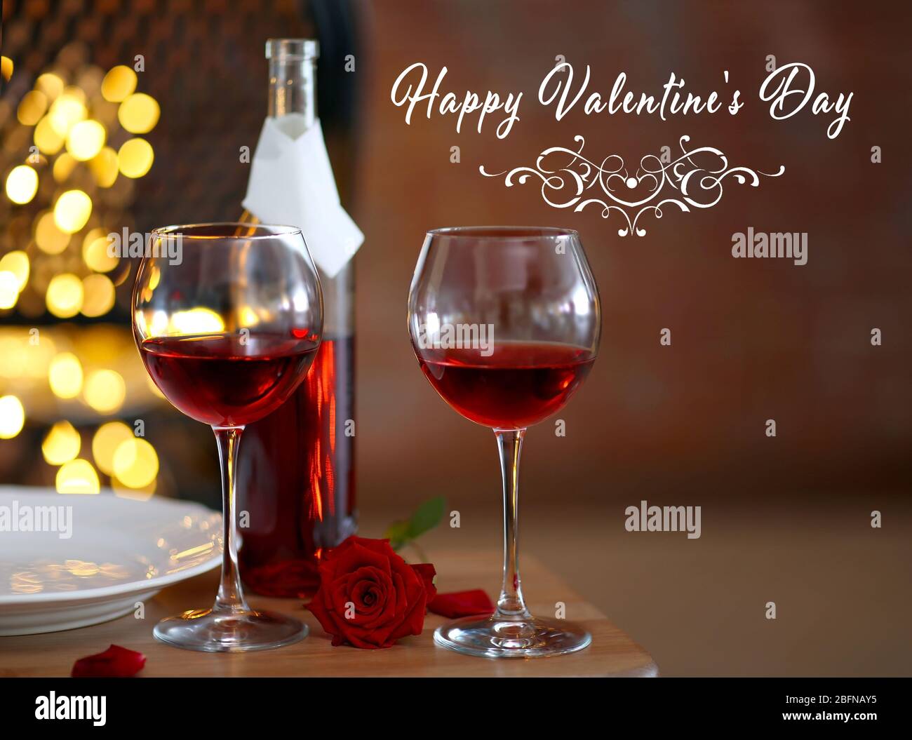 Text HAPPY VALENTINE'S DAY. Glasses and bottle of red wine on table Stock  Photo - Alamy