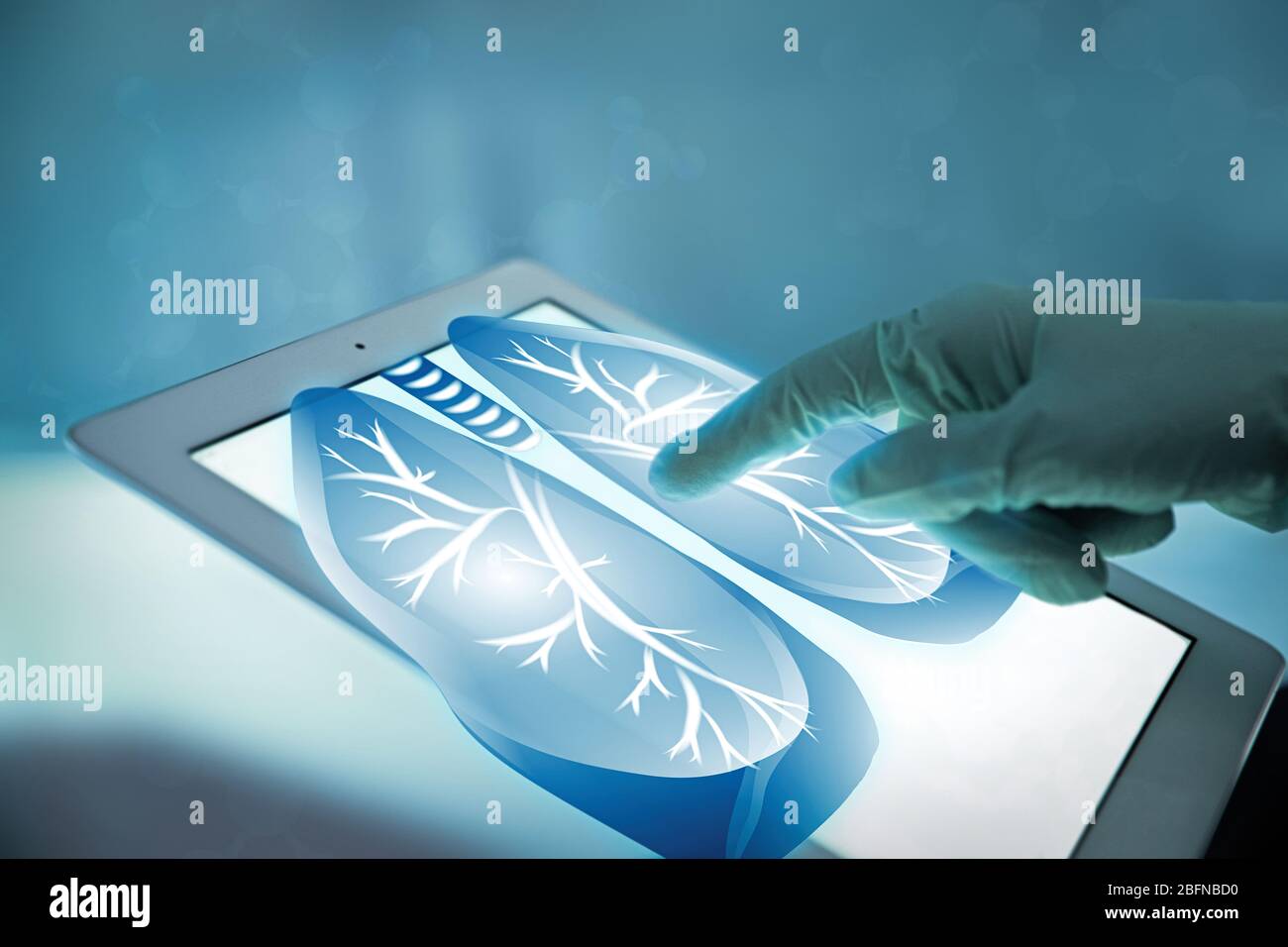 Doctor with tablet, closeup. Lungs on screen. Medicine and modern