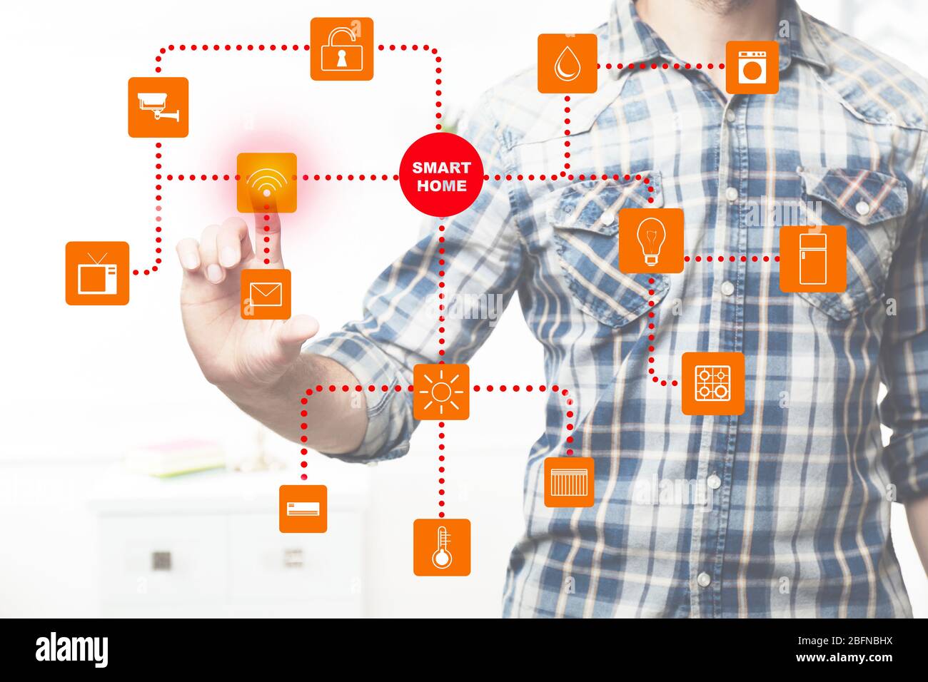 Man using smart home application on virtual screen. Innovation technology concept. Stock Photo