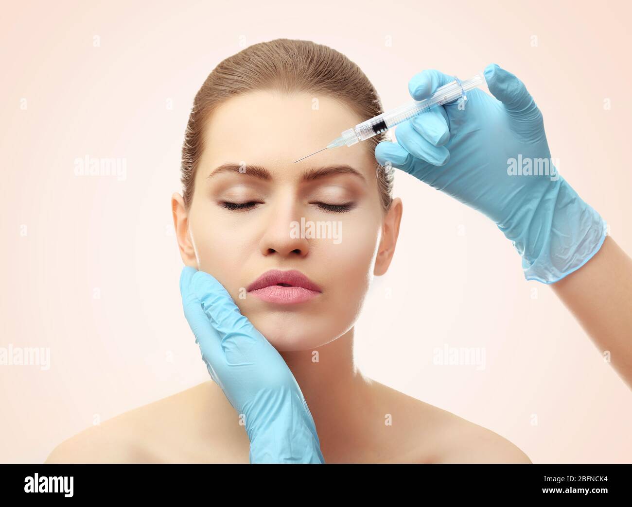 Hyaluronic acid injection for facial rejuvenation procedure. Plastic surgery concept Stock Photo