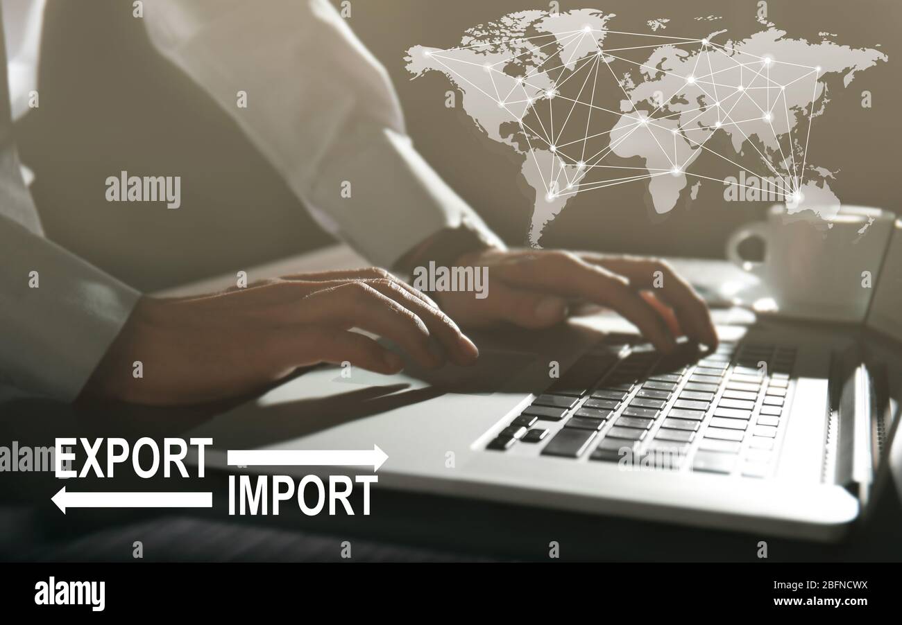 Logistics concept. Man with laptop, closeup. Text EXPORT-IMPORT on background Stock Photo