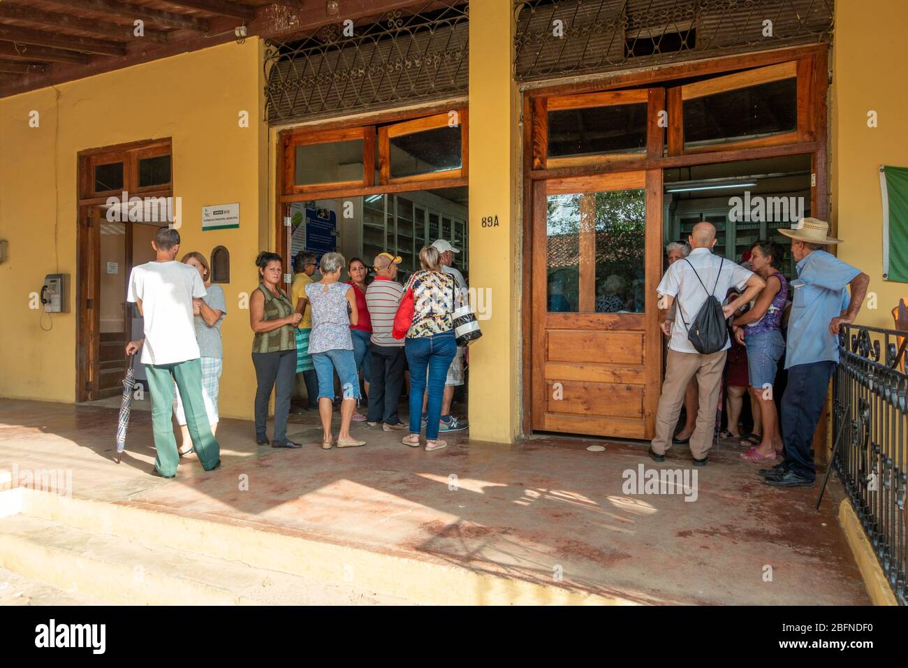 Cuban people queuing at a pharmacy in Vinales the day COVID-19 coronavirus was announced to have arrived in Cuba Stock Photo