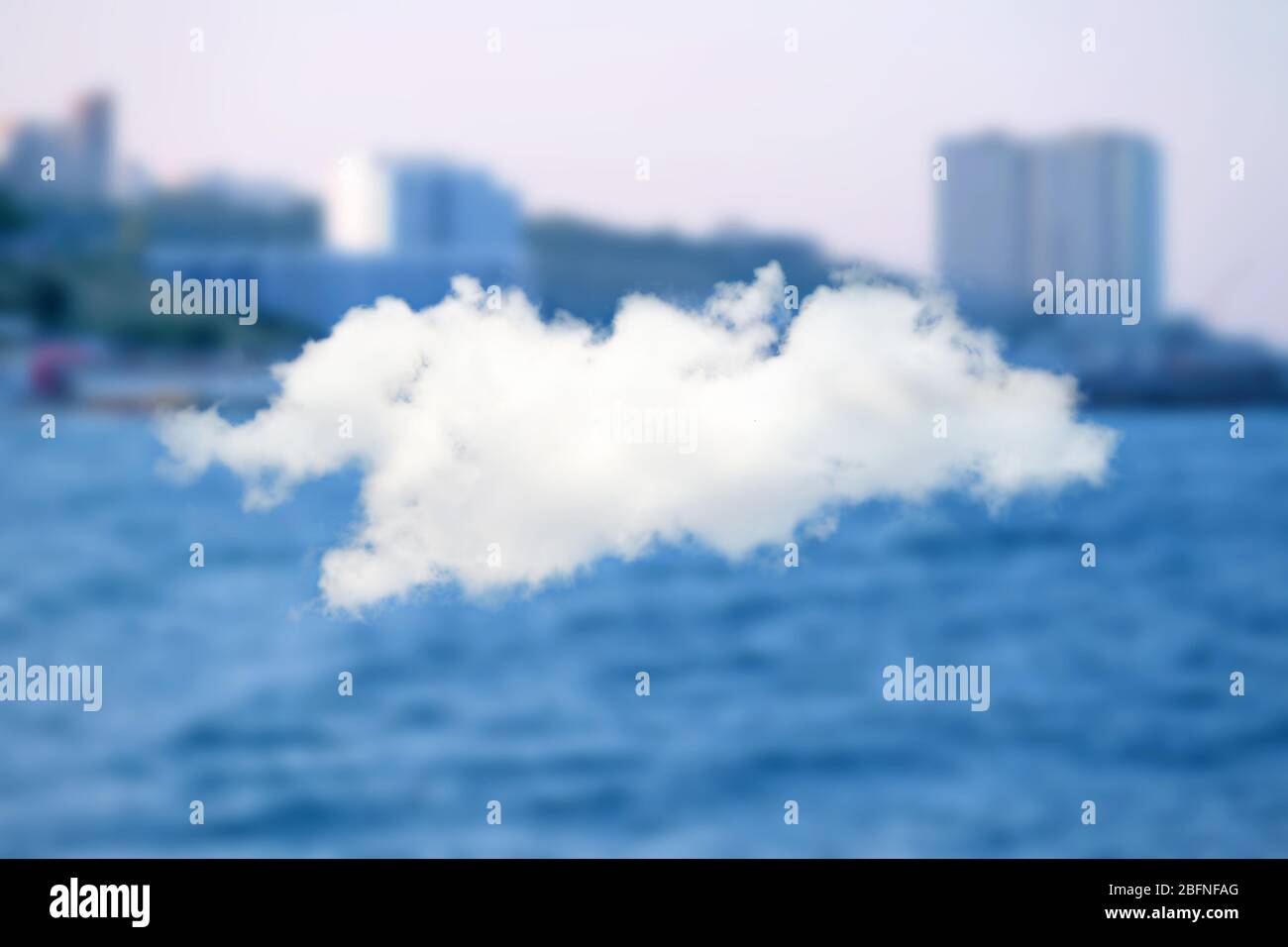 Cloud icon on blurred cityscape background. Modern technology concept Stock Photo