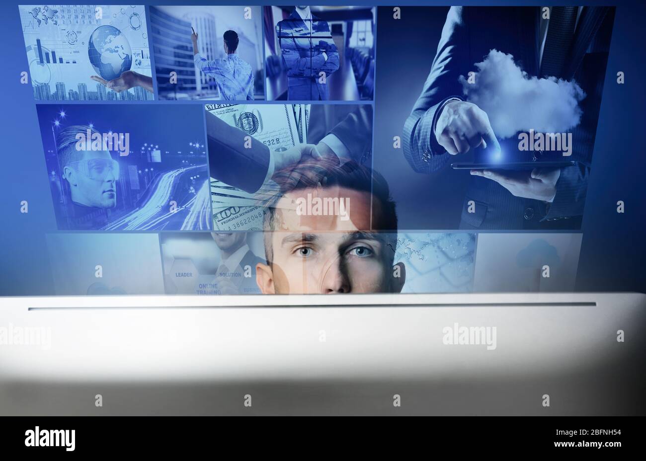 Internet and modern technology concept. Young man working with computer Stock Photo