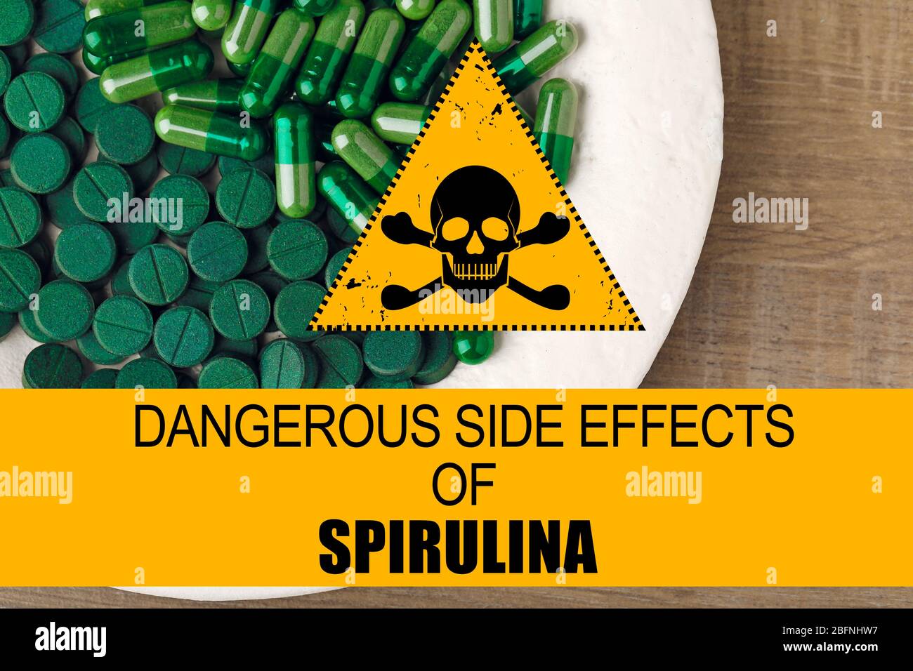 Plate with spirulina pills on table. Side effects concept Stock Photo -  Alamy