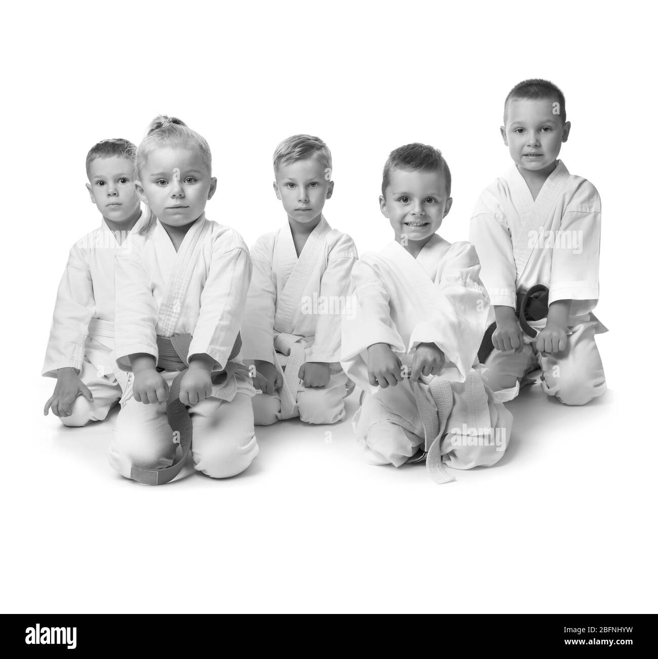 Little children in kimonos on white background Stock Photo