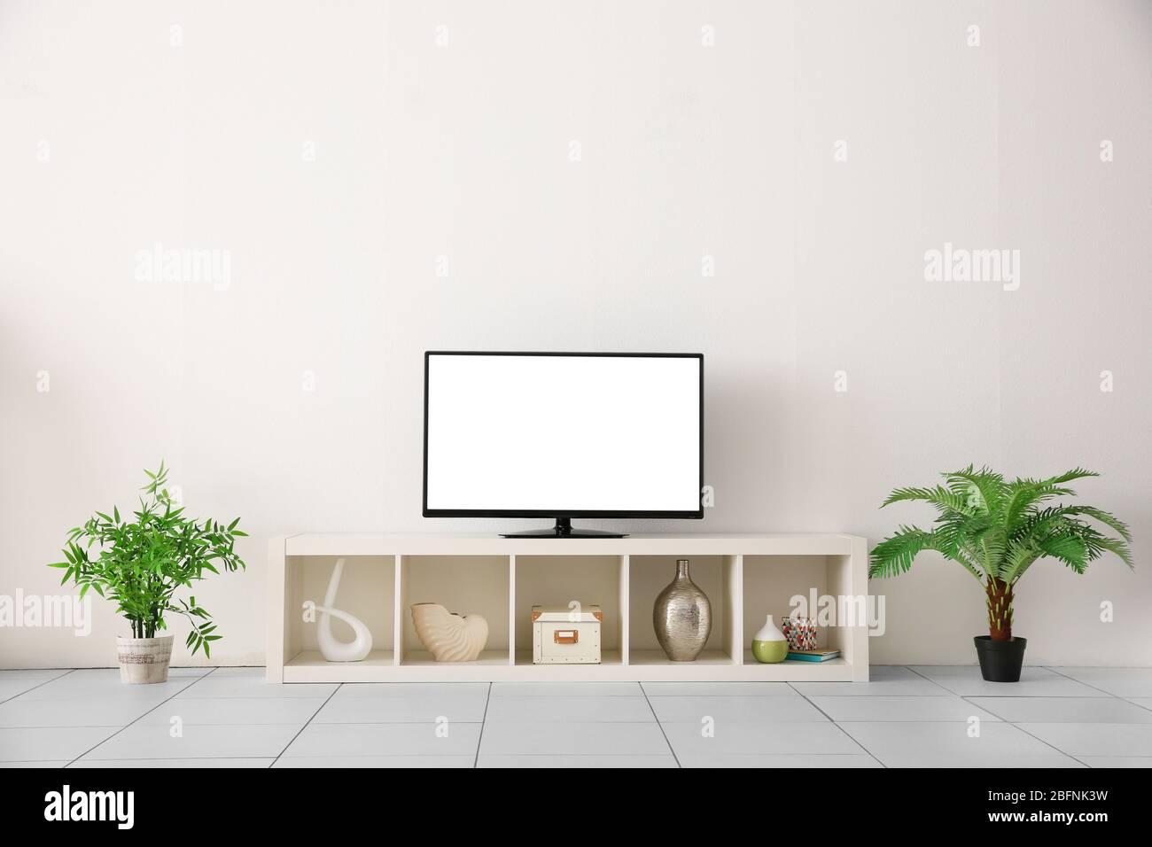 Blank TV display on stand in living room Stock Photo Alamy