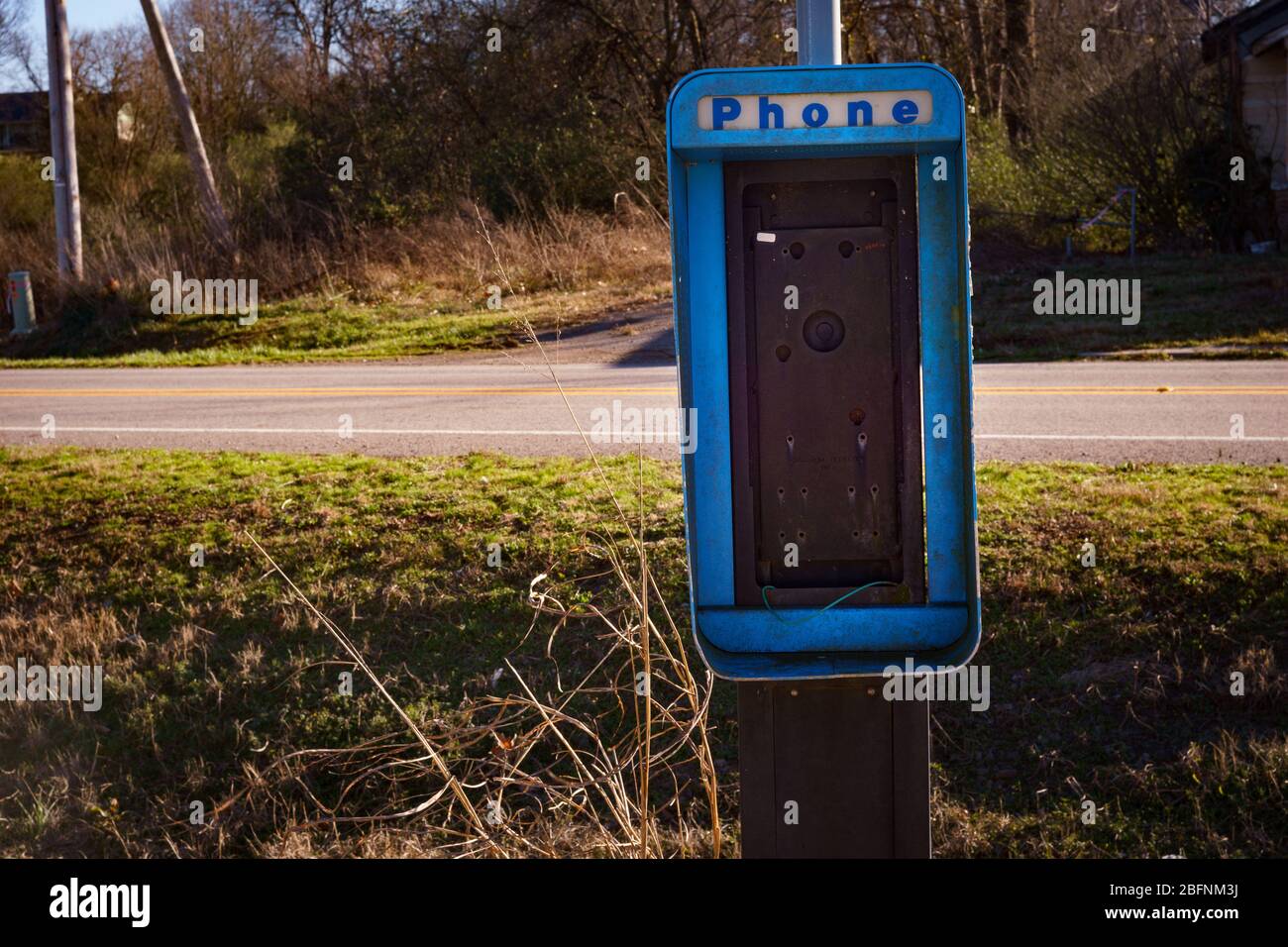 An old and damaged non working pay phone booth in rural Arkansas,Nov 2015. Stock Photo