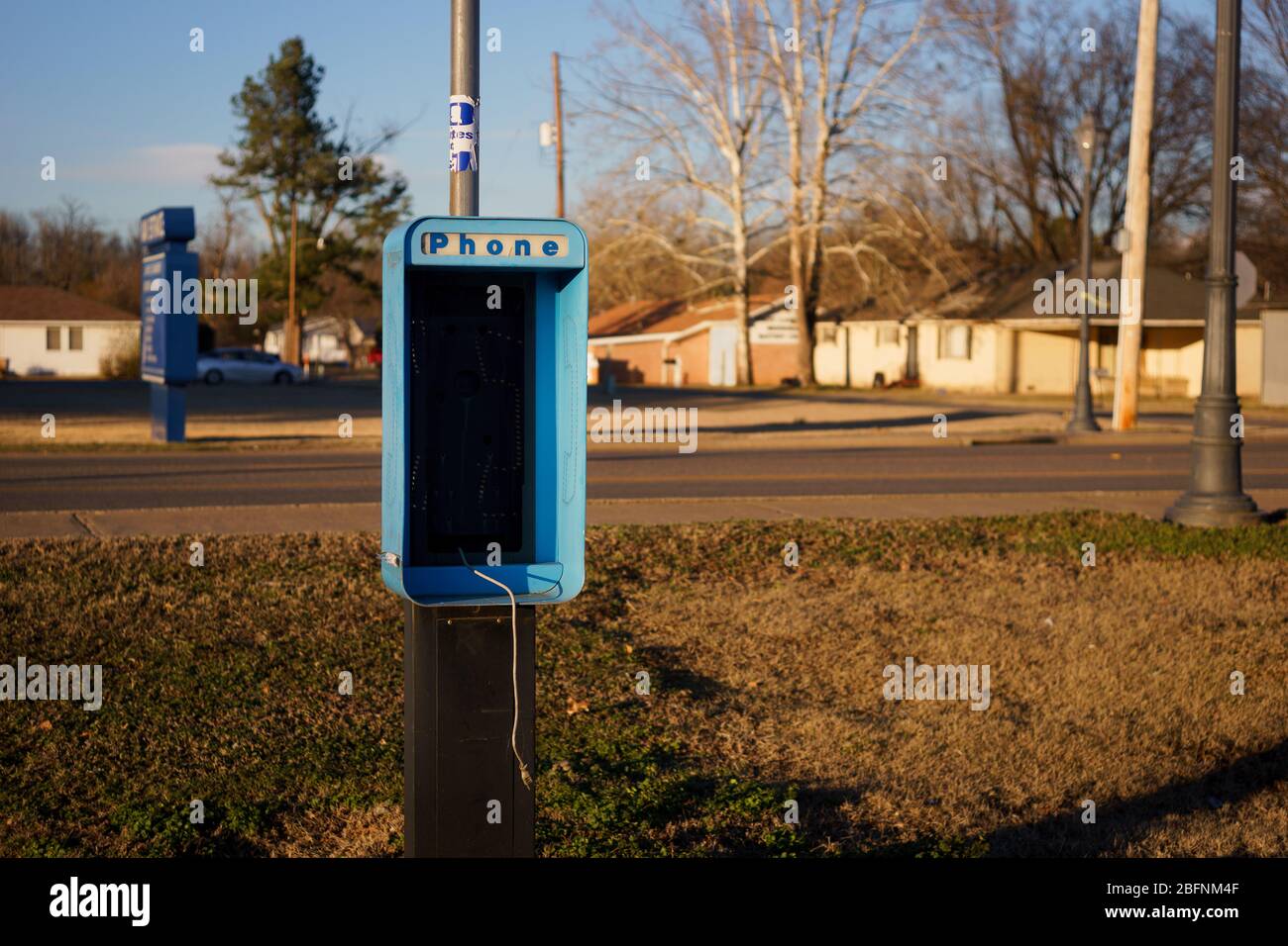 An old and damaged non working pay phone booth in Danville Arkansas, Nov 2015. Stock Photo
