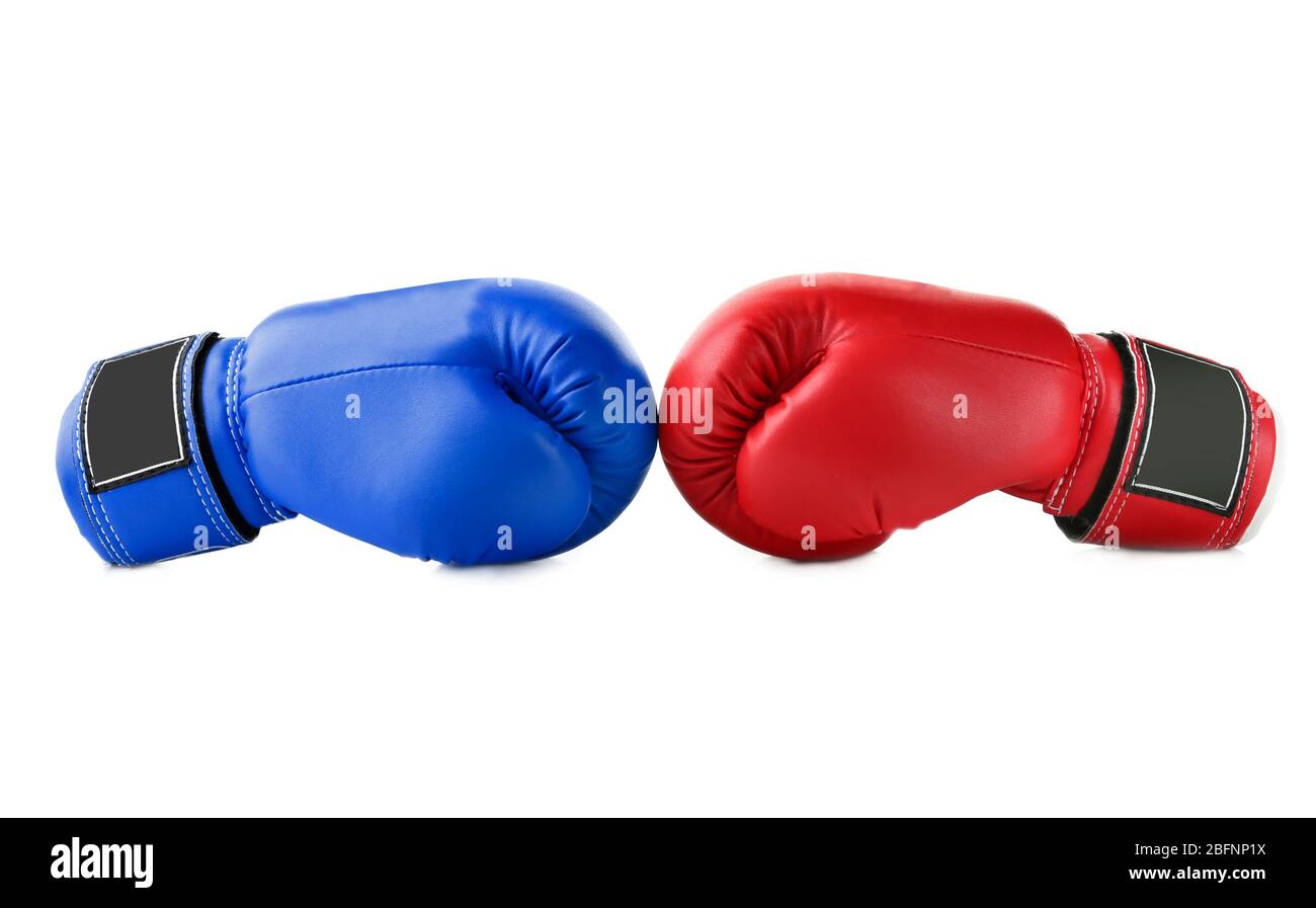 Red and blue boxing gloves on white background. Concept of political confrontation between American major parties - Democratic and Republican Stock Photo