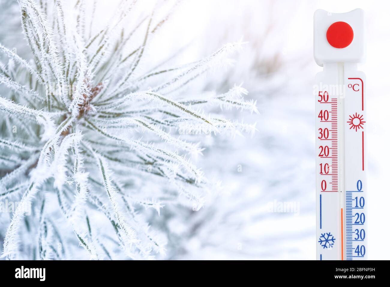 Thermometer registering temperature below zero outdoor Stock Photo