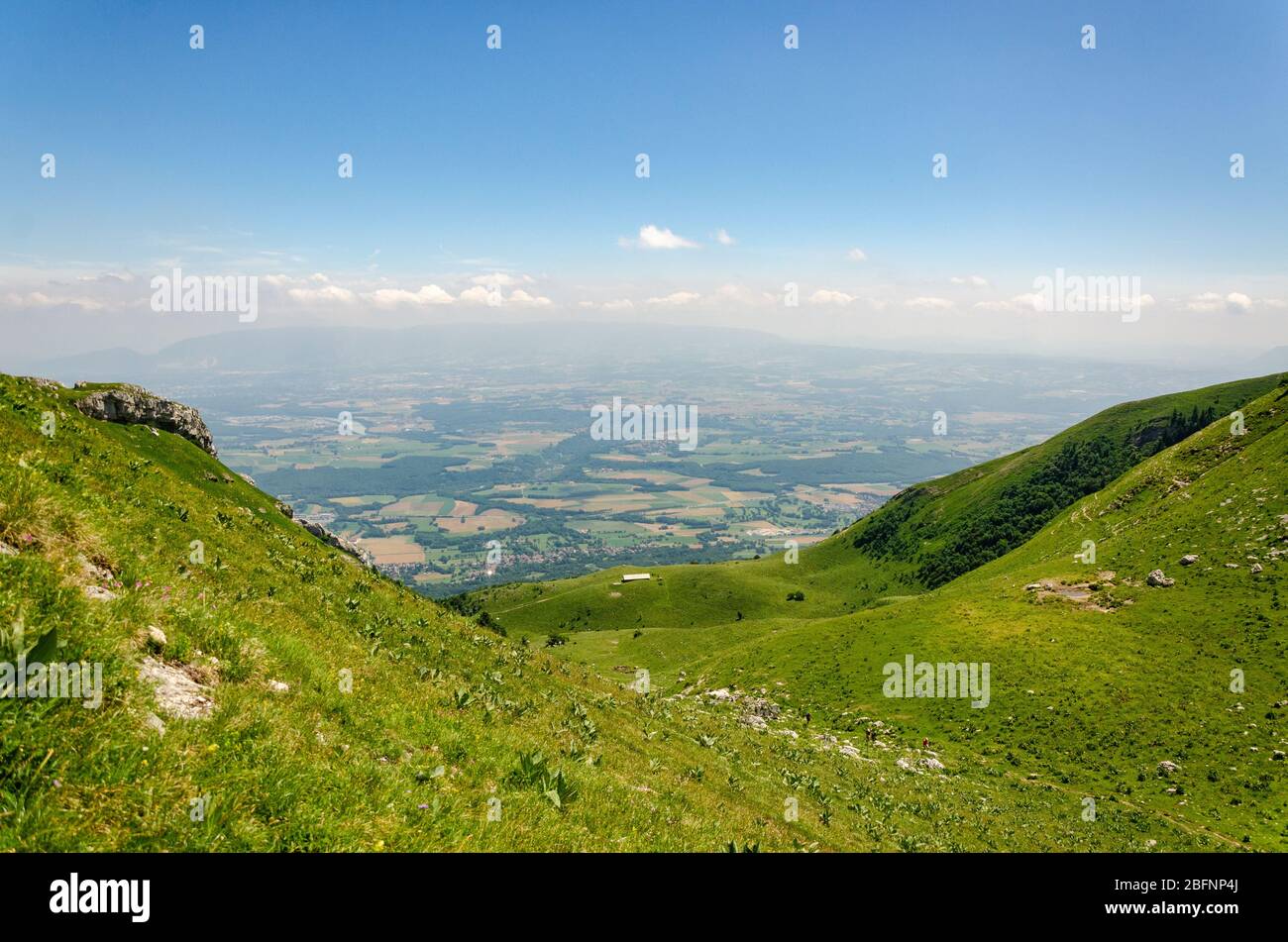View of the Thoiry region in France and Geneva in Switzerland during summer season while hiking to Le Reculet in Jura Mountains, France Stock Photo