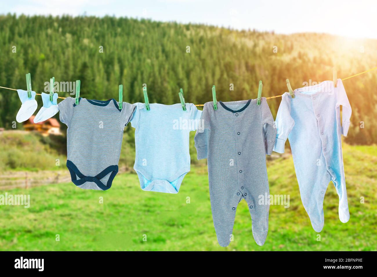 Rope with clean clothes outdoors on laundry day Stock Photo - Alamy