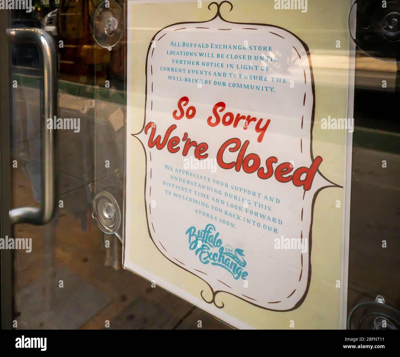 A sign in the window of the Buffalo Exchange recycled clothing store in Chelsea in New York on Friday, April 17, 2020 announces it is closed. Only essential businesses are allowed to be open. (© Richard B. Levine) Stock Photo