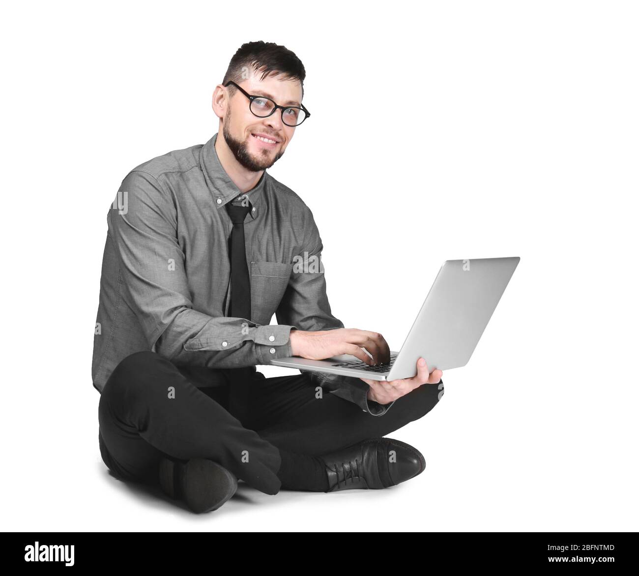 Handsome programmer with laptop on white background Stock Photo