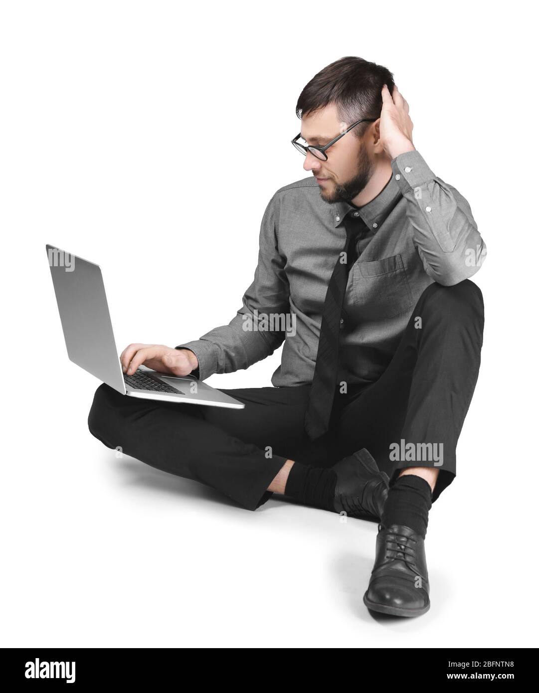 Handsome programmer with laptop on white background Stock Photo