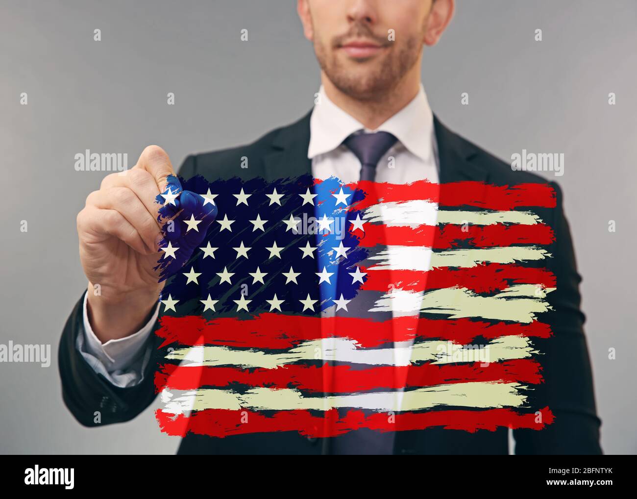 Man drawing USA flag on virtual screen Stock Photo