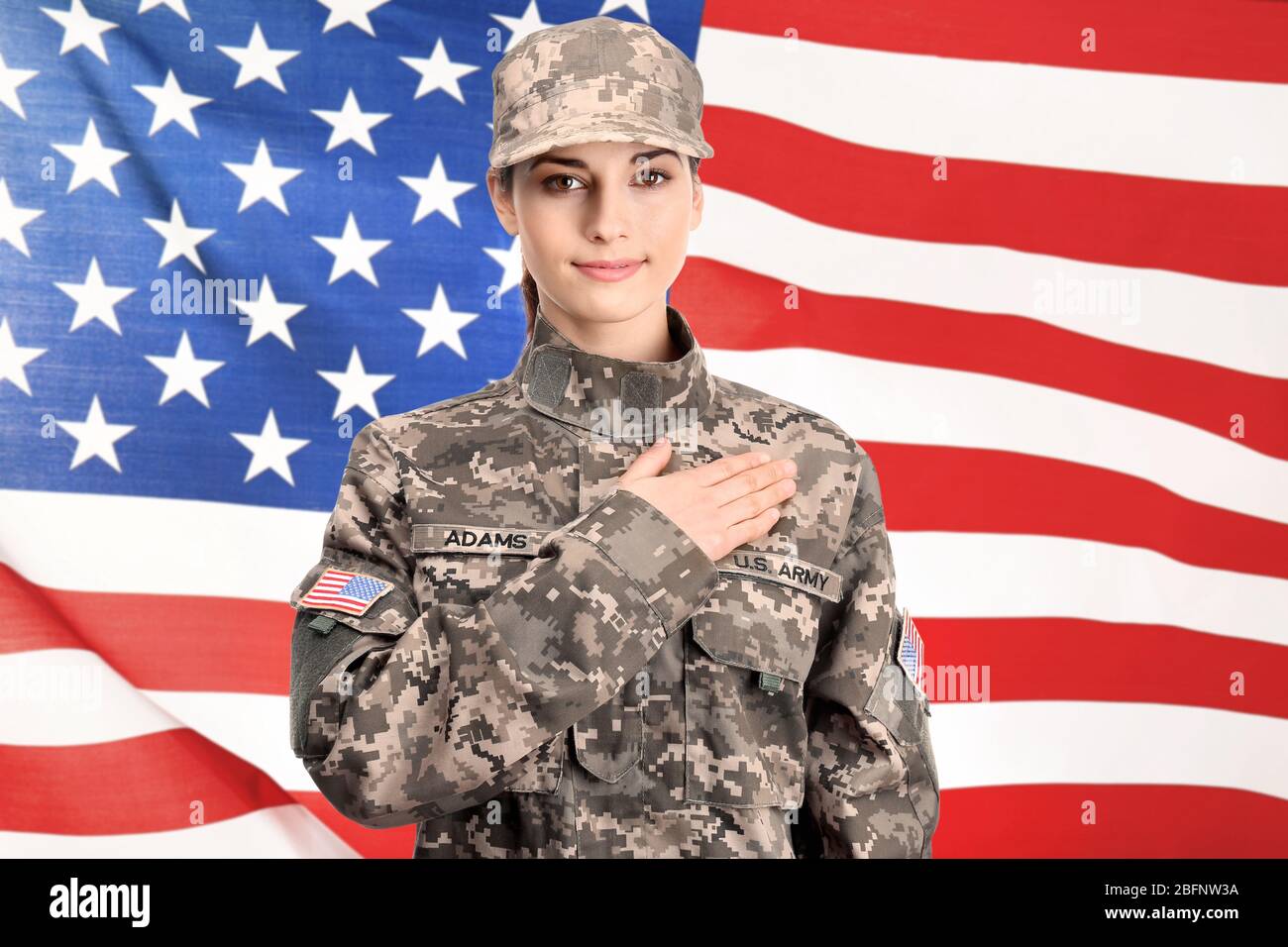 Female soldier on USA flag background Stock Photo - Alamy