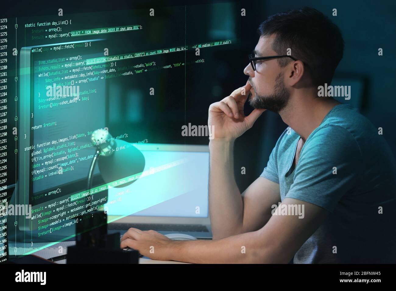 Program development concept. Young man working with computer Stock ...