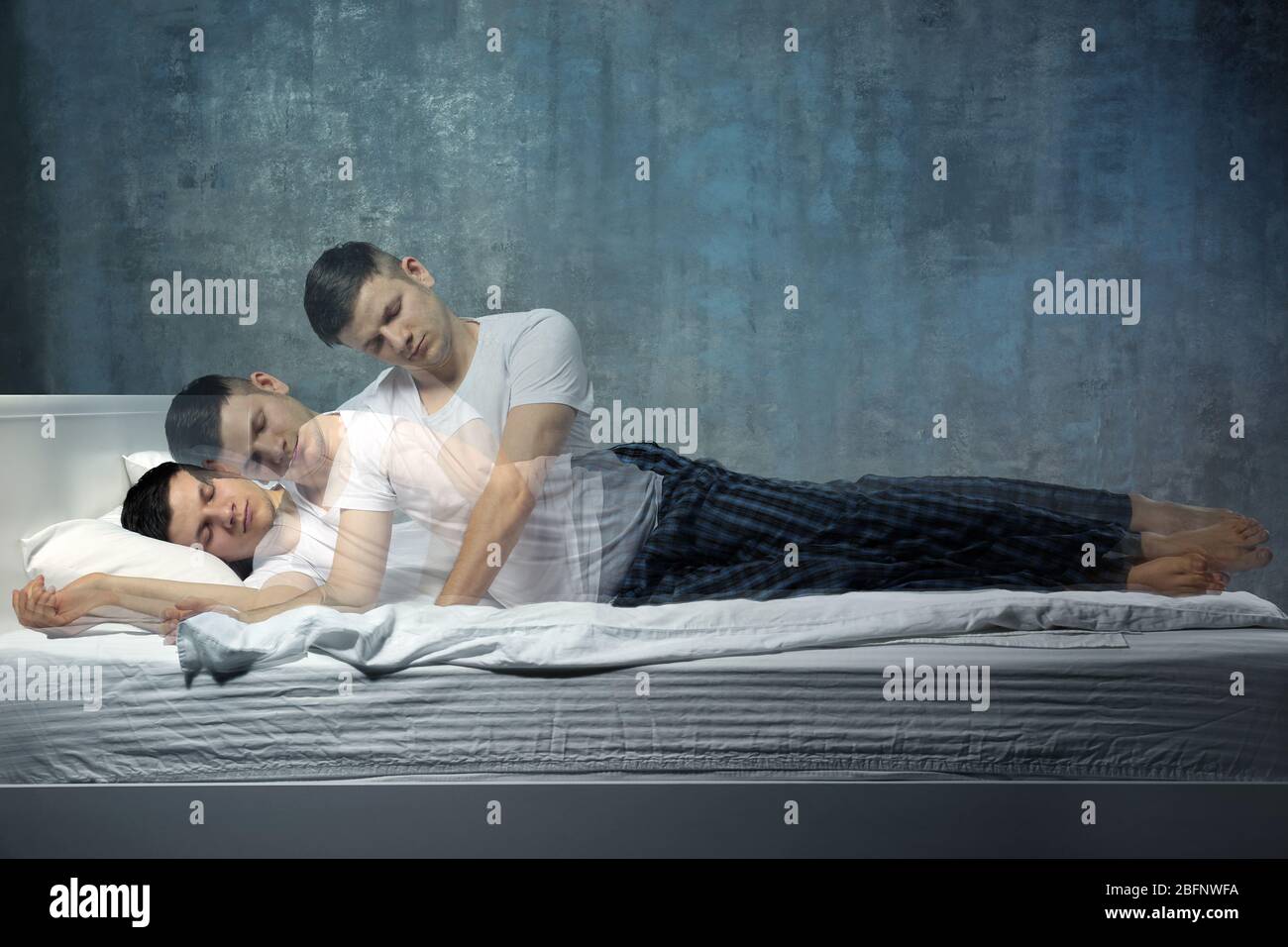 Young man suffering from sleepwalking Stock Photo