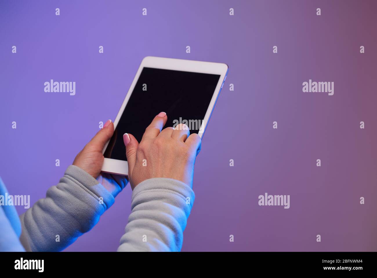 Close-up of man's hands with smartphone and blank black screen on blank ...