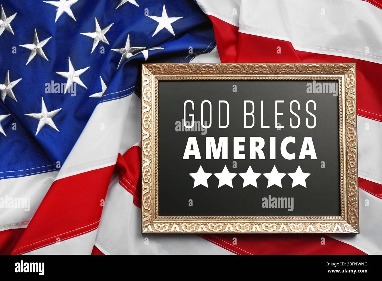 Frame with text GOD BLESS AMERICA on USA flag background Stock Photo - Alamy