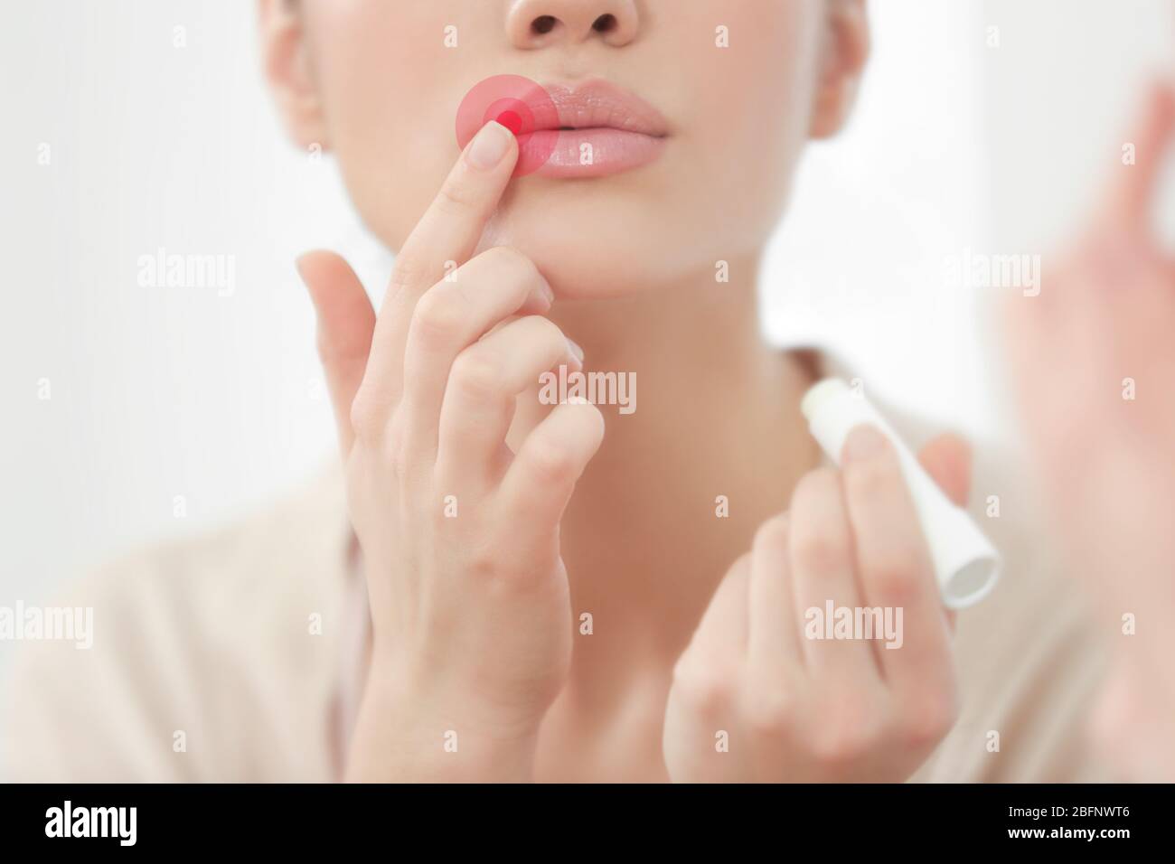 Woman applying balm on lips. Herpes virus concept Stock Photo Alamy