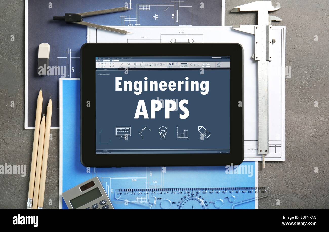 Engineering apps concept. Tablet with drawings on table Stock Photo Alamy