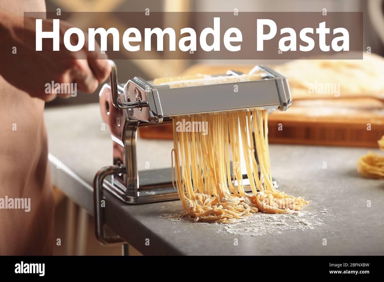Man making homemade pasta with machine Stock Photo Alamy
