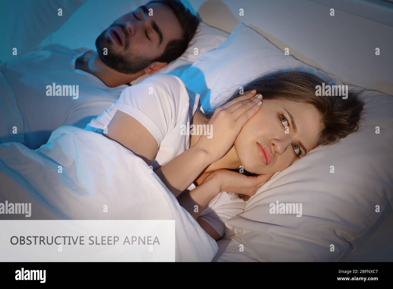 Young woman suffering from husband's snore. Obstructive sleep apnea