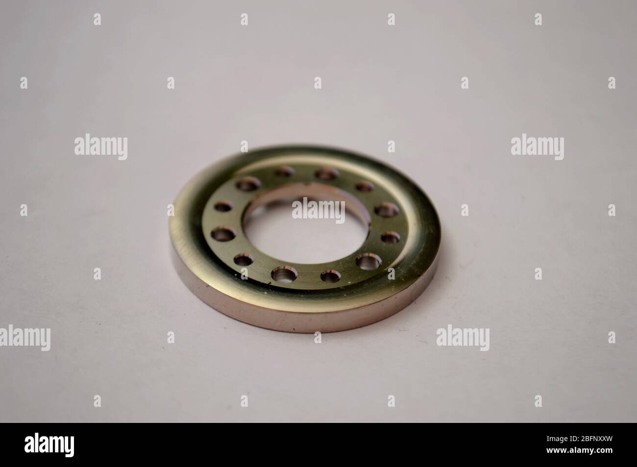 close-up of a chrome washer with holes Stock Photo