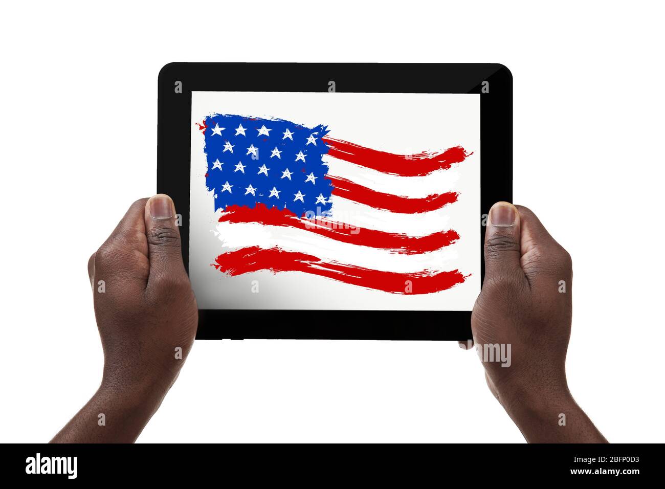 African-American man holding tablet with USA flag against white background Stock Photo
