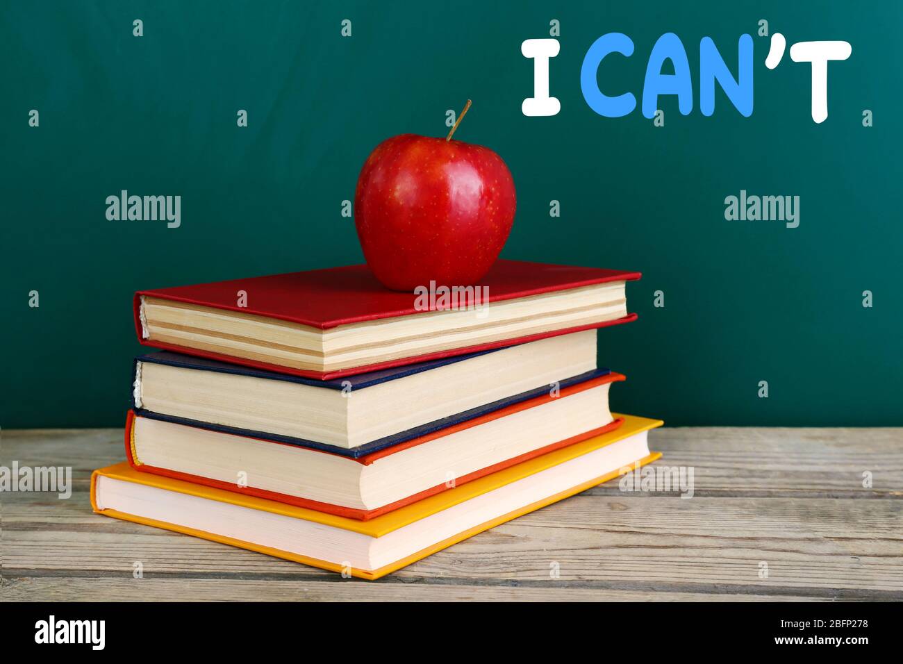Word impossible transformed into possible on blackboard and textbooks Stock Photo
