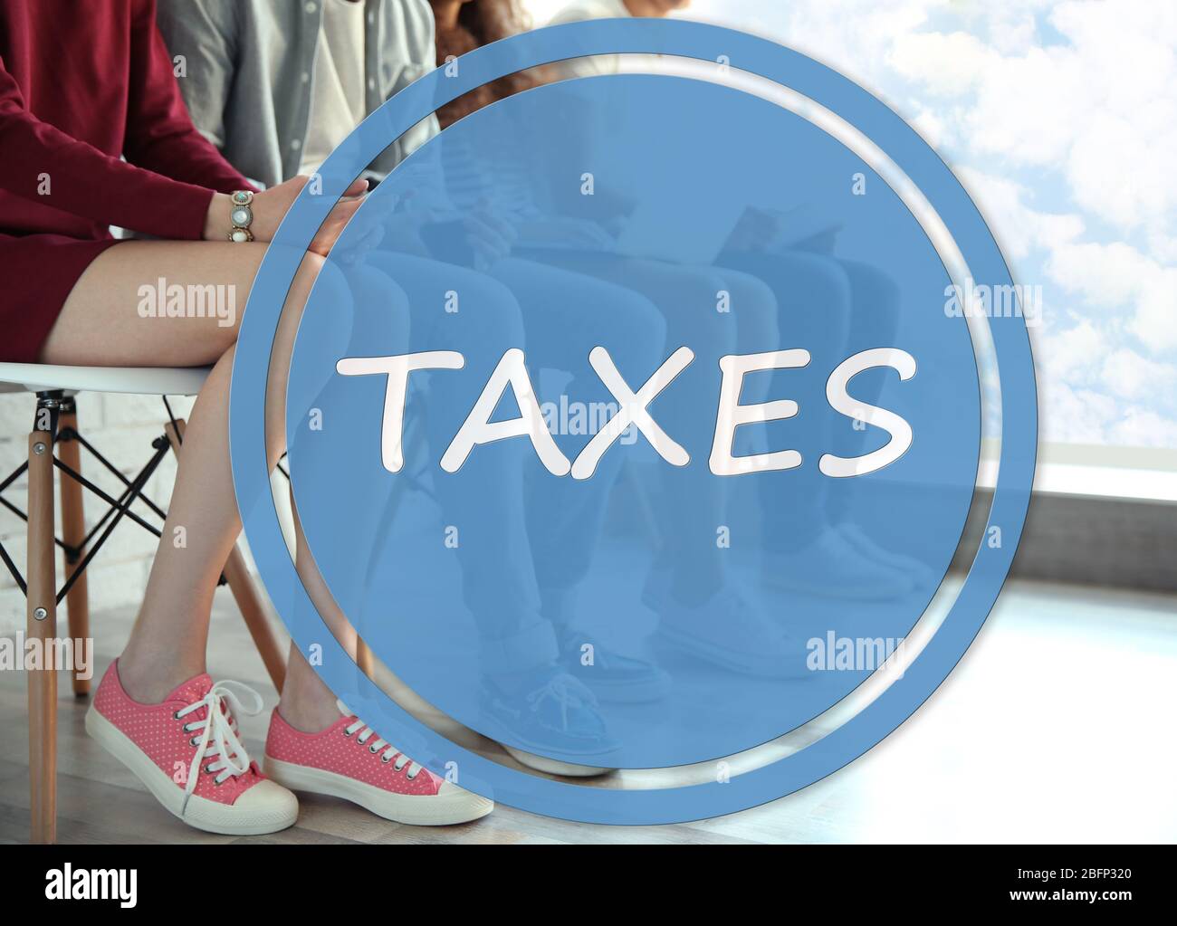Taxes concept. Group of people with digital devices sitting on chairs ...