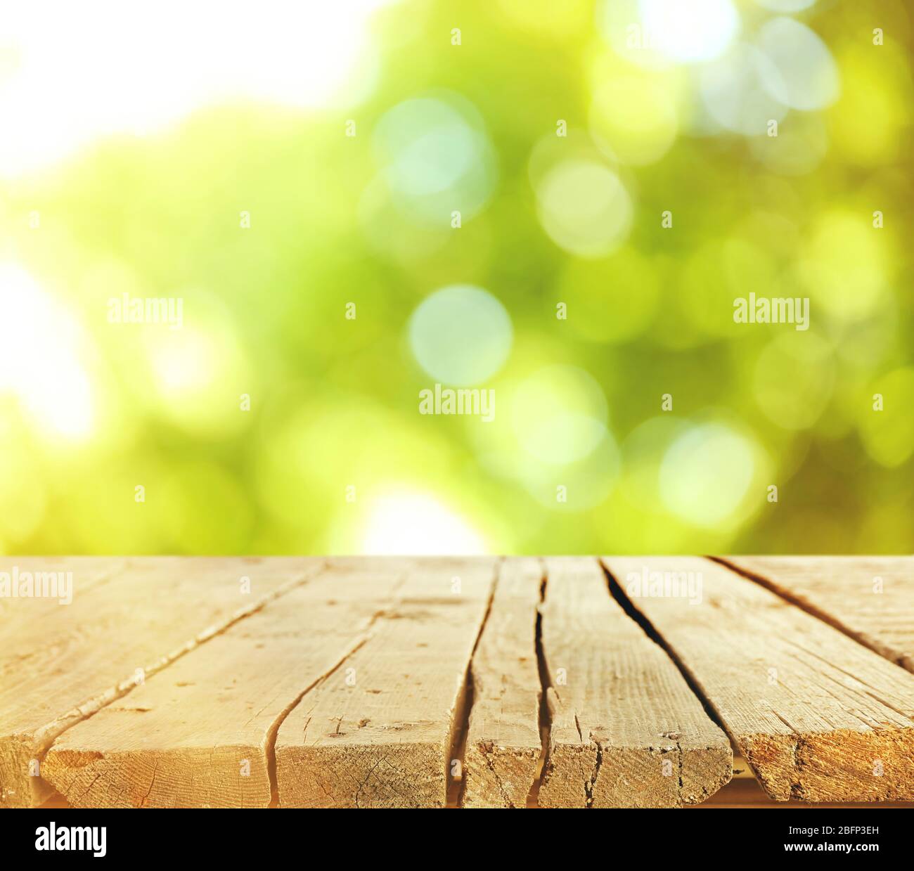 Abstract nature bokeh background and empty wood table Stock Photo - Alamy