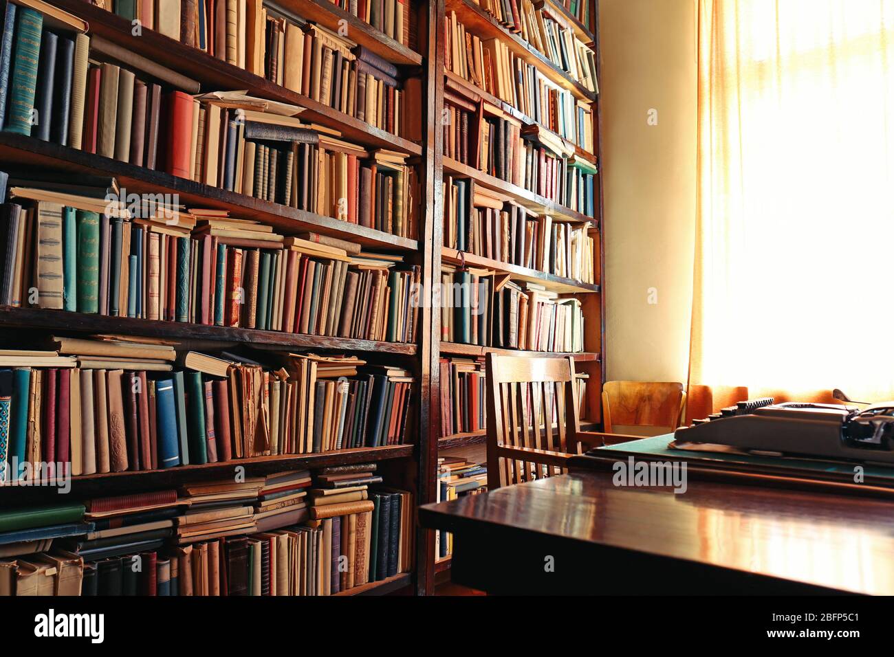Old bookshelf in library Stock Photo - Alamy