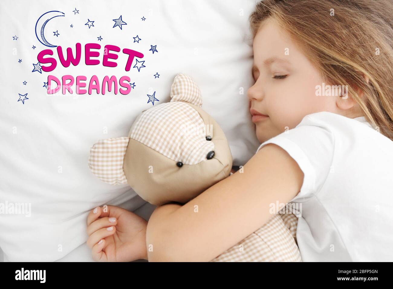 Cute little girl sleeping with teddy bear in bed Stock Photo - Alamy