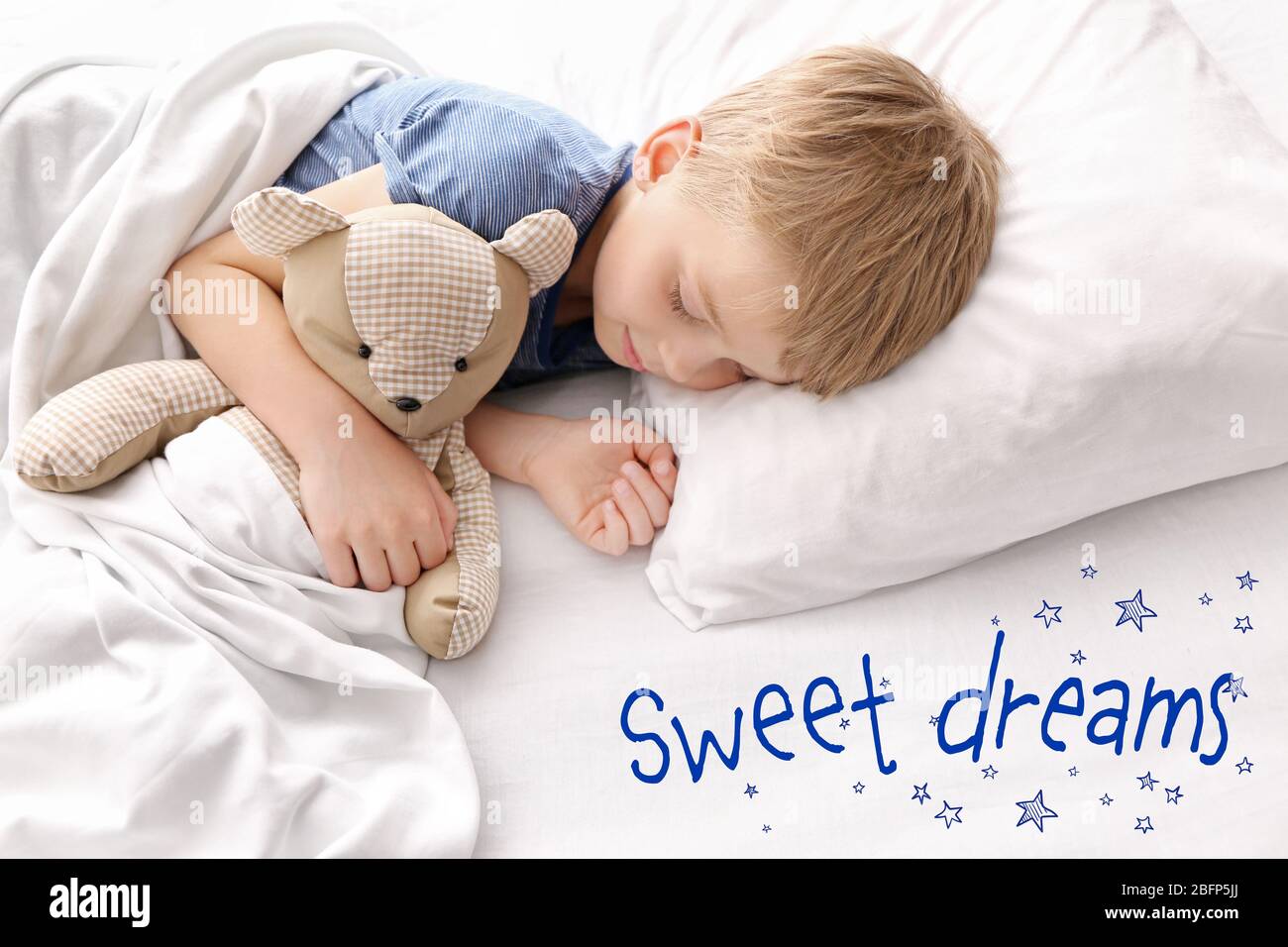 Adorable little boy sleeping with teddy bear in bed Stock Photo - Alamy