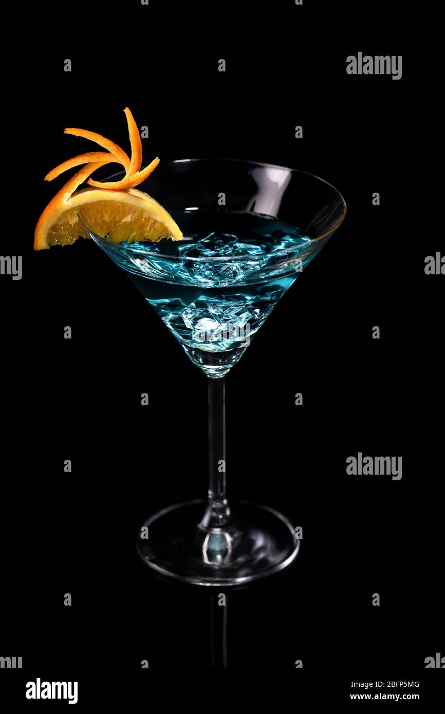 Art in orange- fruits carving. How to make to citrus garnish design for a drink. Martini Blue Curacao Stock Photo