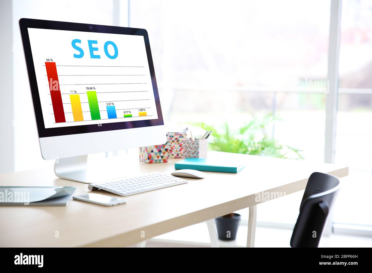 SEO technology concept. Modern workplace interior. Stock Photo