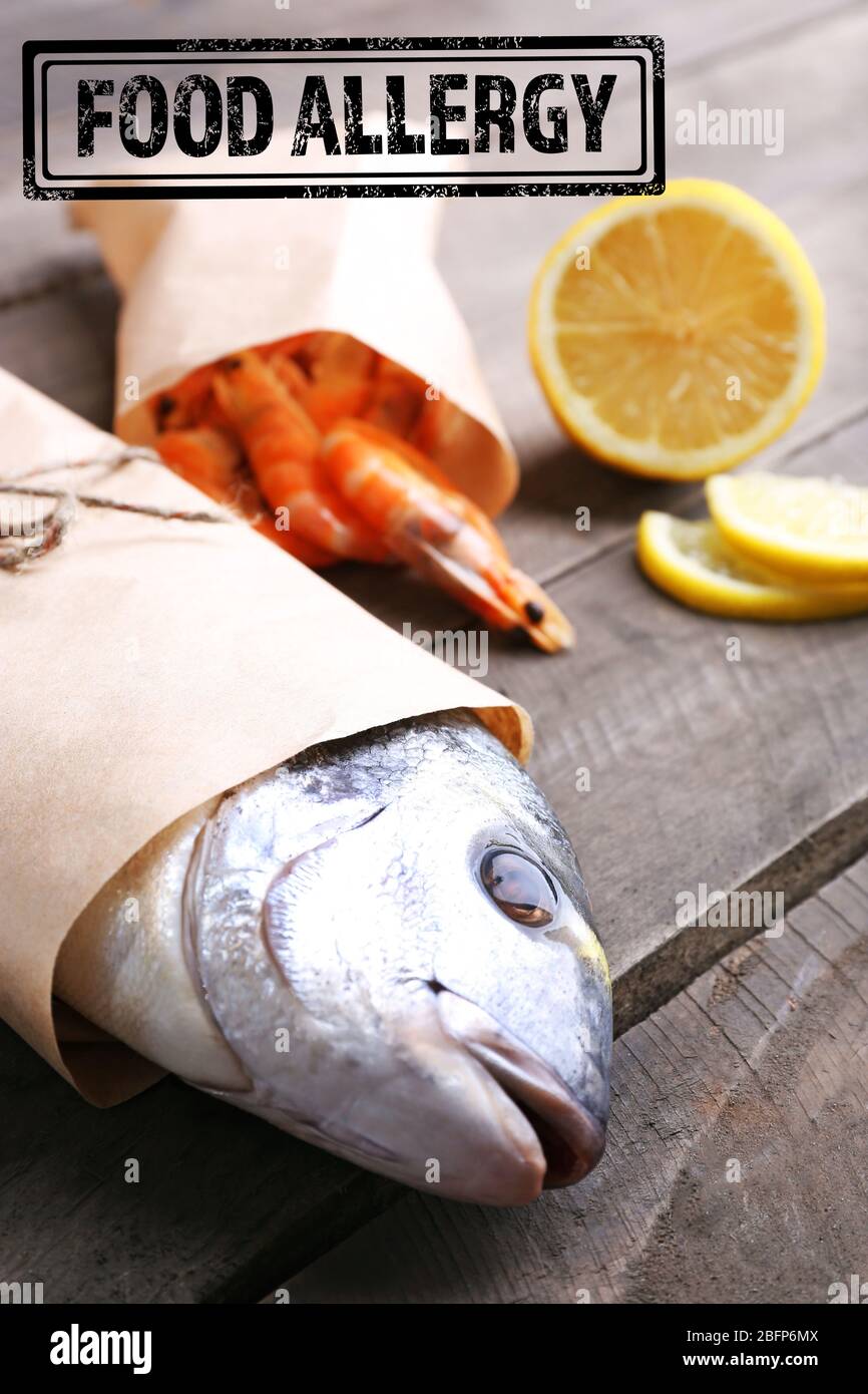 Allergy danger concept. Seafood with sliced lemon and stamp food