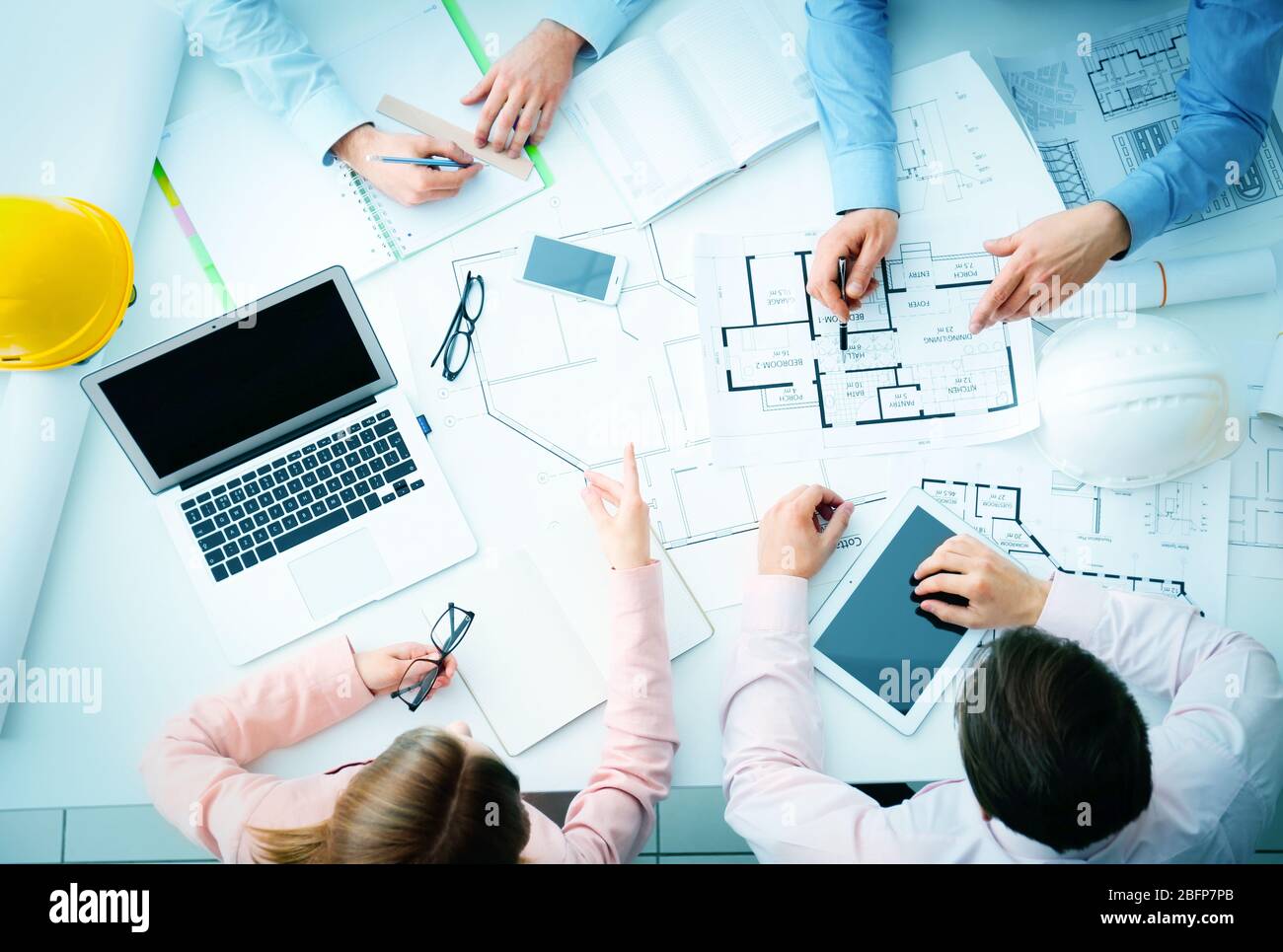 Young engineers working in the office, top view Stock Photo