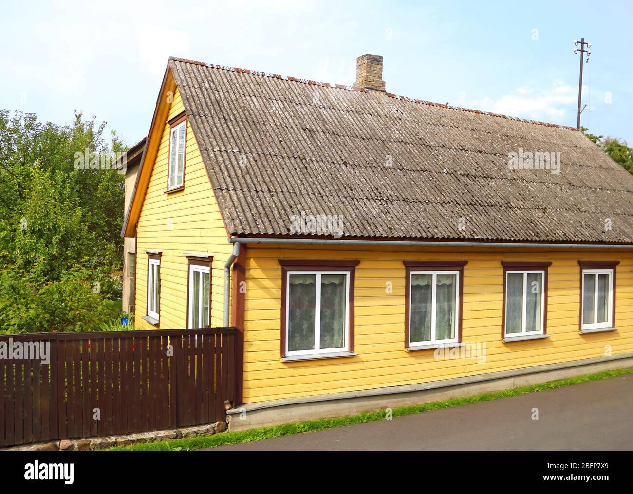 View of street with old wooden house in Parnu Estonia Stock Photo