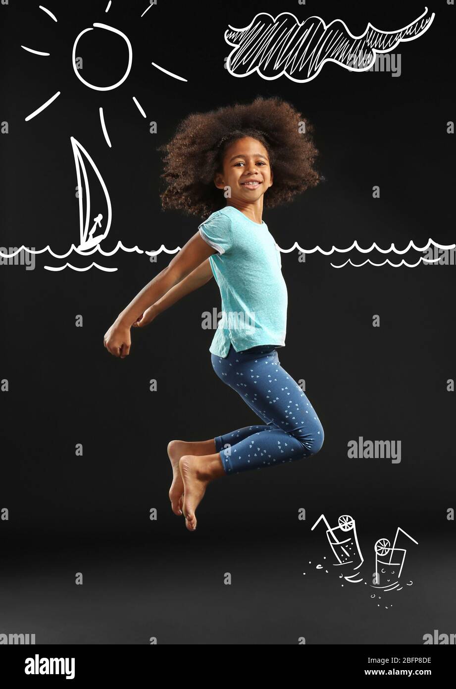 Happy African girl jumping on black background Stock Photo - Alamy