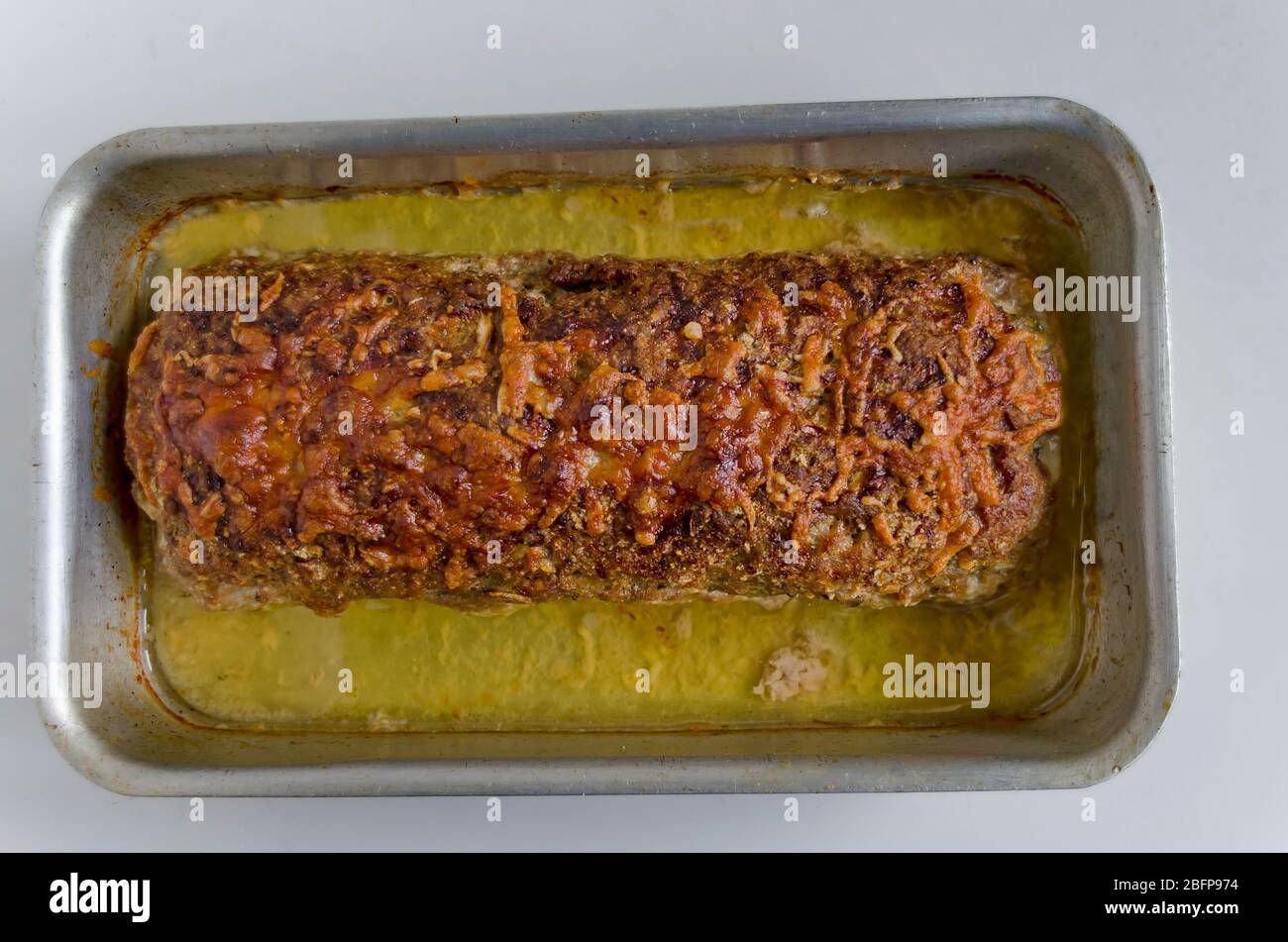 Meatloaf of roasted minced meat with spices, slice boiled egg and pickled cucumber, Sofia, Bulgaria Stock Photo