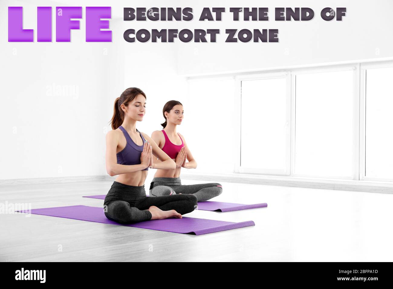Comfort zone concept. Young women doing yoga in gym Stock Photo Alamy