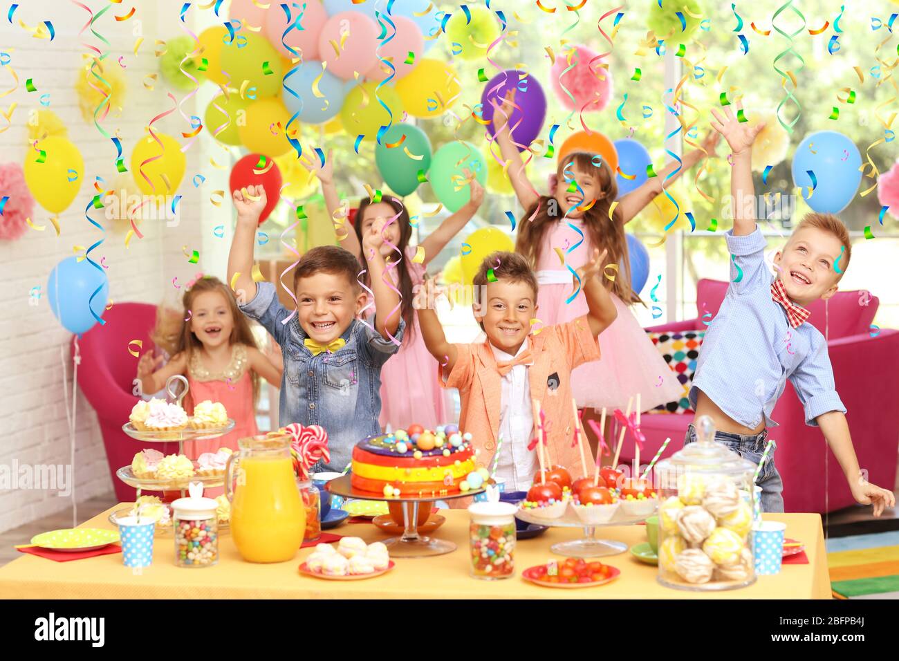 Children's funny birthday party in decorated room Stock Photo - Alamy