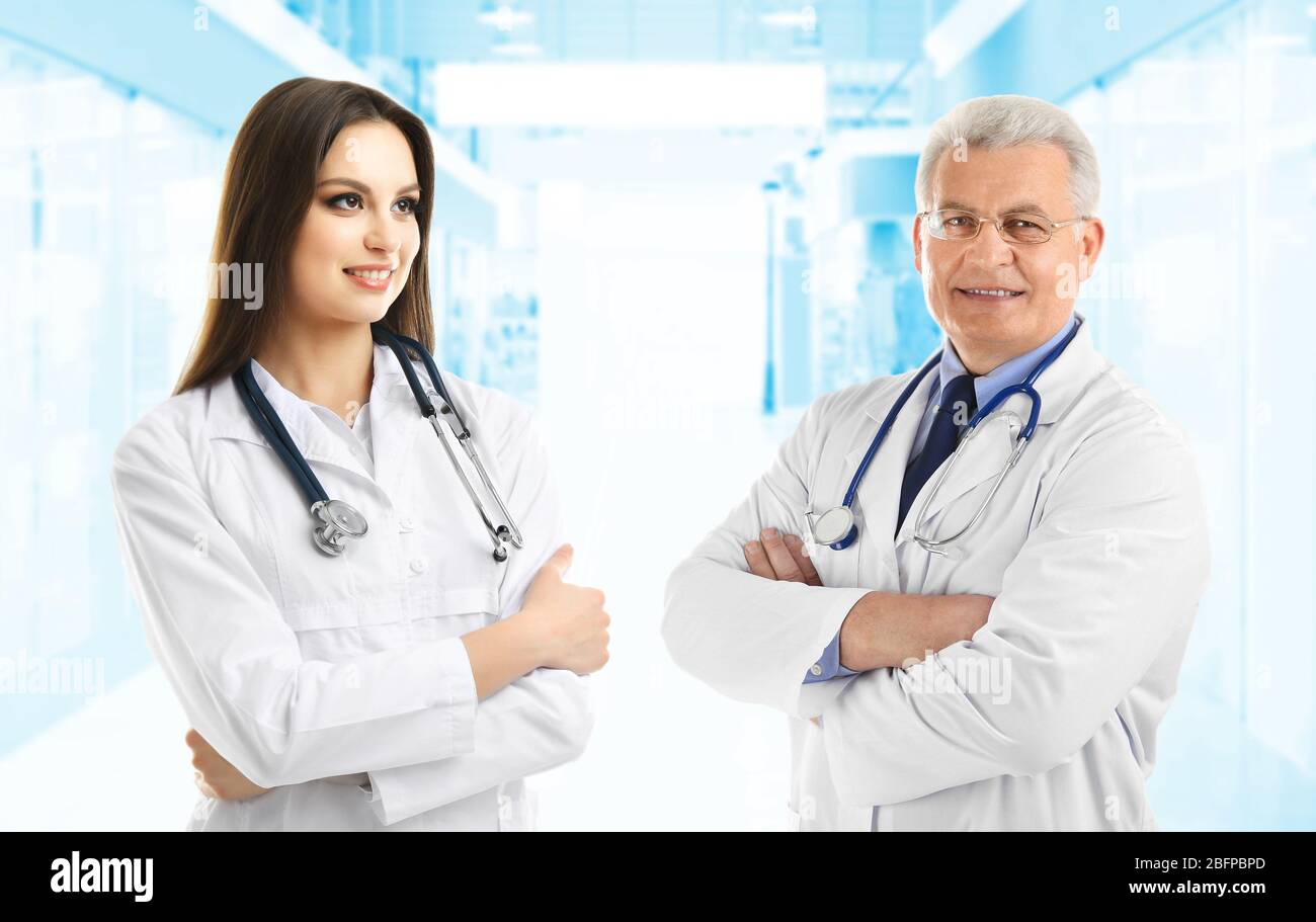 Doctors on blurred hospital background. Medical service concept Stock Photo  - Alamy